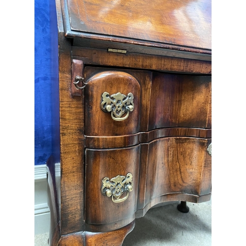 25 - A MAHOGANY QUEEN ANNE STYLE BUREAU BOOKCASE, the carved pediment to arched top with shell motif to c... 