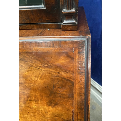 25 - A MAHOGANY QUEEN ANNE STYLE BUREAU BOOKCASE, the carved pediment to arched top with shell motif to c... 