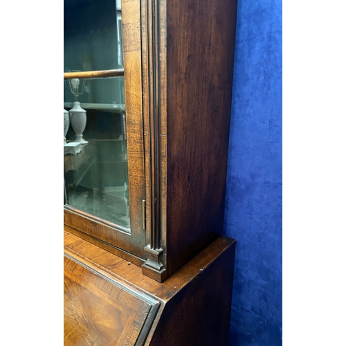 25 - A MAHOGANY QUEEN ANNE STYLE BUREAU BOOKCASE, the carved pediment to arched top with shell motif to c... 