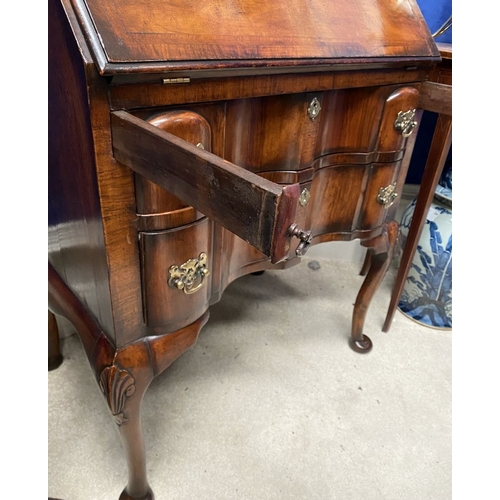 25 - A MAHOGANY QUEEN ANNE STYLE BUREAU BOOKCASE, the carved pediment to arched top with shell motif to c... 