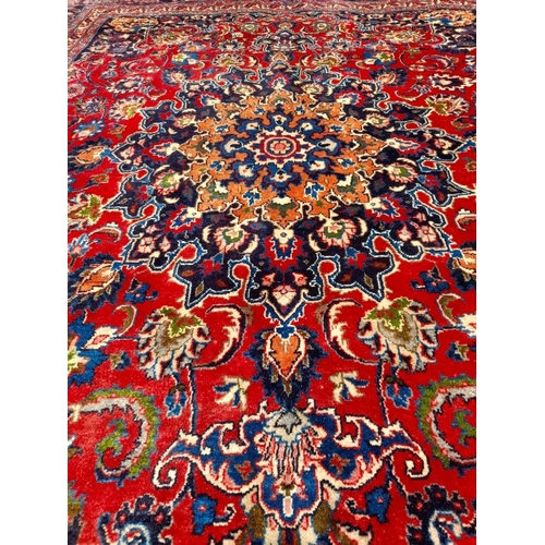 252 - AN EXCELLENT PERSIAN MASHAD RUG, hand knotted, high knot density, dyed using natural vegetable dyes.... 