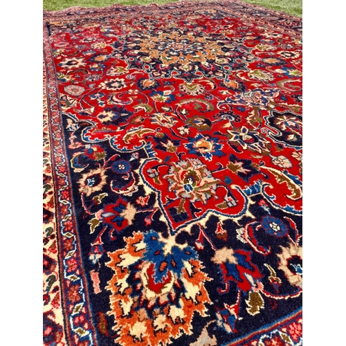 252 - AN EXCELLENT PERSIAN MASHAD RUG, hand knotted, high knot density, dyed using natural vegetable dyes.... 