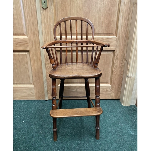256 - A 19TH CENTURY HARDWOOD CHILDREN’S HIGHCHAIR, c.1820. Winsor style chair, with hoop back and spindle... 