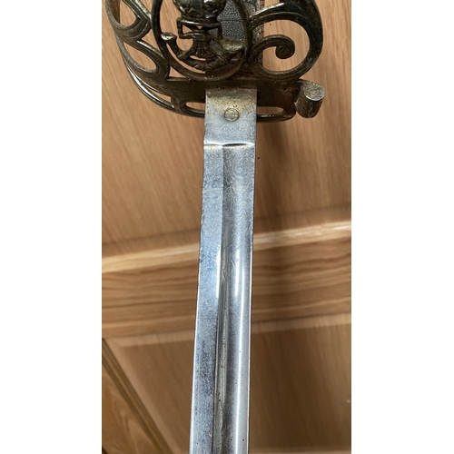 265 - A 19TH CENTURY BRITISH OFFICER’S SWORD, the handle carries the design of the Wilkinson Rifle Brigade... 