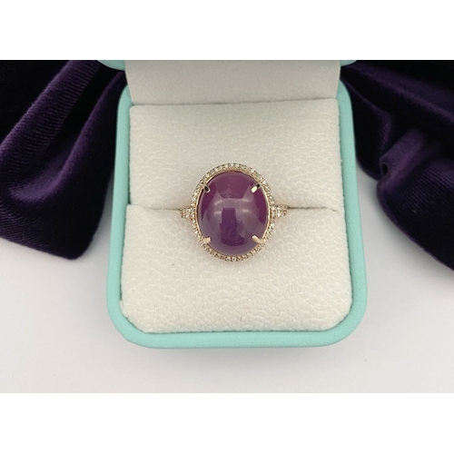 35 - A STRIKING 14CT YELLOW GOLD OVAL CABOCHON RUBY & DIAMOND CLUSTER RING, with central oval cabochon cu... 