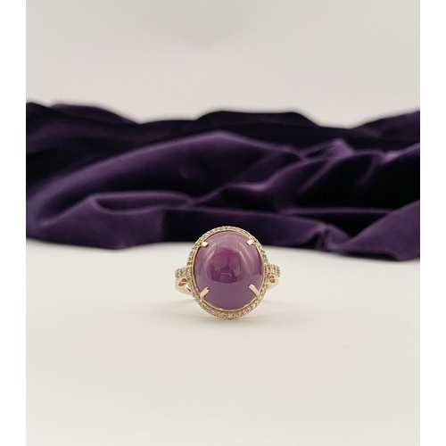 35 - A STRIKING 14CT YELLOW GOLD OVAL CABOCHON RUBY & DIAMOND CLUSTER RING, with central oval cabochon cu... 