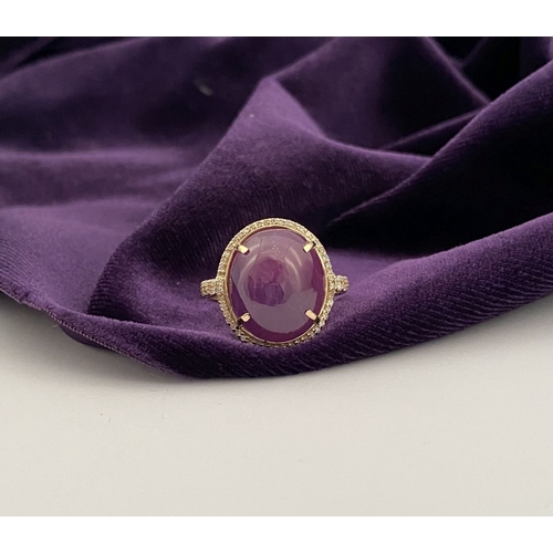 35 - A STRIKING 14CT YELLOW GOLD OVAL CABOCHON RUBY & DIAMOND CLUSTER RING, with central oval cabochon cu... 