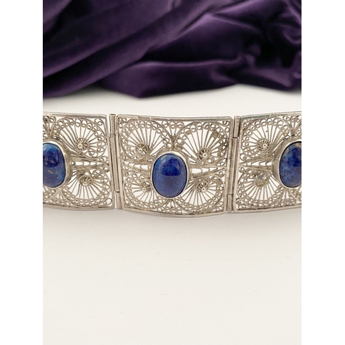 47 - A VICTORIAN FILIGREE SILVER BRACELET WITH LAPIS LAZULI CABOCHONS, with five oval lapis lazuli caboch... 