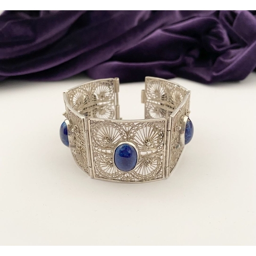 47 - A VICTORIAN FILIGREE SILVER BRACELET WITH LAPIS LAZULI CABOCHONS, with five oval lapis lazuli caboch... 