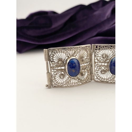 47 - A VICTORIAN FILIGREE SILVER BRACELET WITH LAPIS LAZULI CABOCHONS, with five oval lapis lazuli caboch... 
