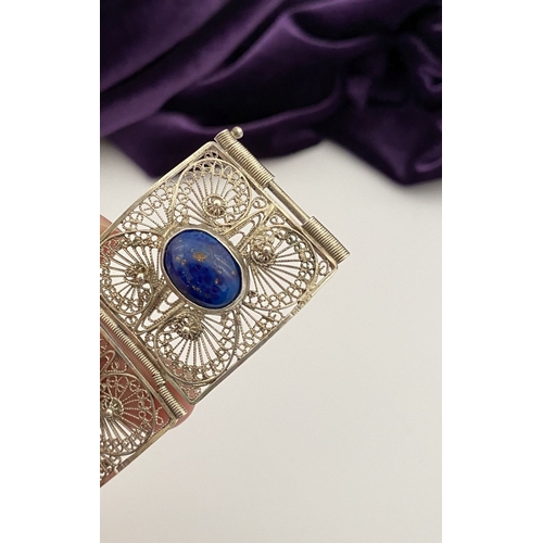 47 - A VICTORIAN FILIGREE SILVER BRACELET WITH LAPIS LAZULI CABOCHONS, with five oval lapis lazuli caboch... 