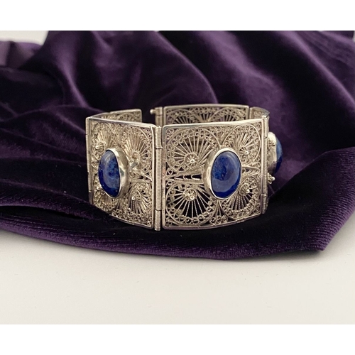 47 - A VICTORIAN FILIGREE SILVER BRACELET WITH LAPIS LAZULI CABOCHONS, with five oval lapis lazuli caboch... 