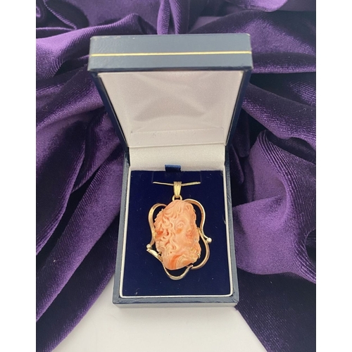 48 - A BEAUTIFUL 9CT GOLD ORANGE CORAL PENDANT NECKLACE WITH DIAMONDS, finely carved orange coral bust ho... 