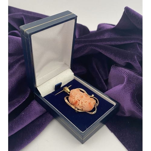 48 - A BEAUTIFUL 9CT GOLD ORANGE CORAL PENDANT NECKLACE WITH DIAMONDS, finely carved orange coral bust ho... 