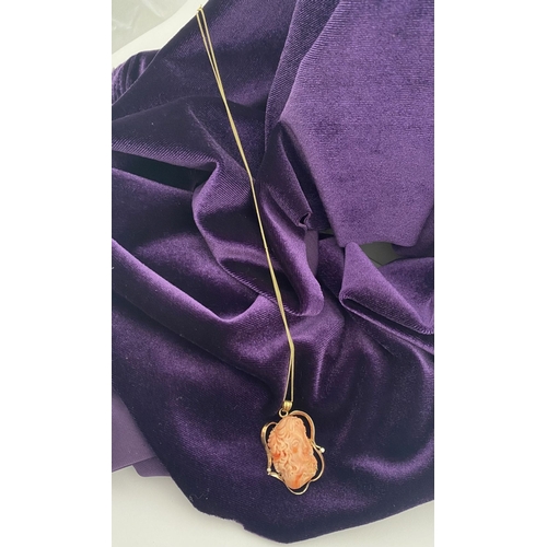48 - A BEAUTIFUL 9CT GOLD ORANGE CORAL PENDANT NECKLACE WITH DIAMONDS, finely carved orange coral bust ho... 