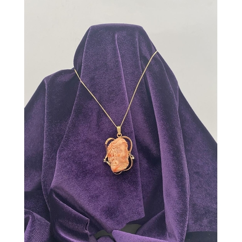 48 - A BEAUTIFUL 9CT GOLD ORANGE CORAL PENDANT NECKLACE WITH DIAMONDS, finely carved orange coral bust ho... 