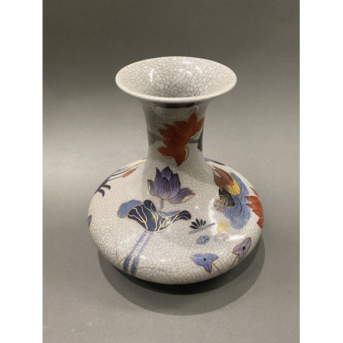 49 - AN ANTIQUE CHINESE CRACKLE GLAZED VASE, with flared rim, long concave neck and bulbous body, raised ... 