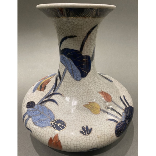 49 - AN ANTIQUE CHINESE CRACKLE GLAZED VASE, with flared rim, long concave neck and bulbous body, raised ... 
