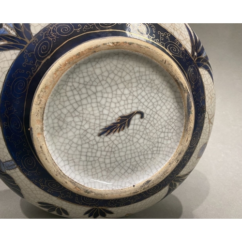 49 - AN ANTIQUE CHINESE CRACKLE GLAZED VASE, with flared rim, long concave neck and bulbous body, raised ... 