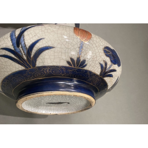 49 - AN ANTIQUE CHINESE CRACKLE GLAZED VASE, with flared rim, long concave neck and bulbous body, raised ... 