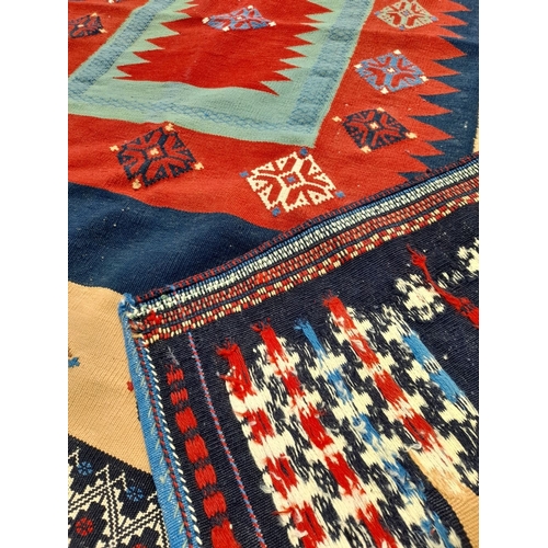 55 - A VIBRANT TURKISH KILIM RUG, hand knotted, dyed using natural vegetable dyes, high knot density. In ... 
