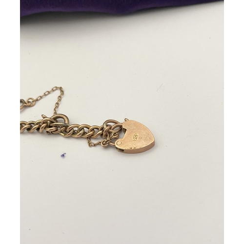 157 - A 9CT GOLD HEART LOCK PENDANT BRACELET, Figaro chain link bracelet, with heart lock pendant hallmark... 