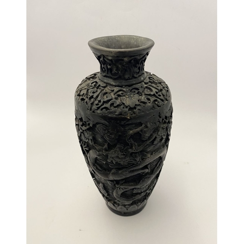 91 - A CHINESE CARVED BLACK CINNABAR LACQUER VASE, the body decorated with incised dragon and smoke motif... 