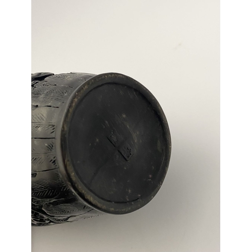 91 - A CHINESE CARVED BLACK CINNABAR LACQUER VASE, the body decorated with incised dragon and smoke motif... 