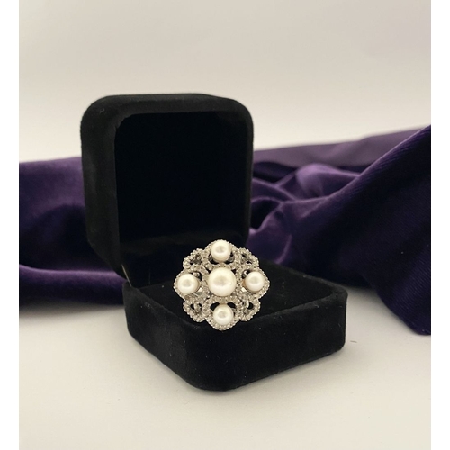 20 - AN ORNATE 9CT WHITE GOLD PEARL & DIAMOND STATEMENT RING, featuring five pearls on white gold setting... 