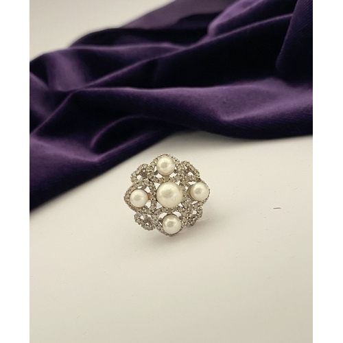 20 - AN ORNATE 9CT WHITE GOLD PEARL & DIAMOND STATEMENT RING, featuring five pearls on white gold setting... 