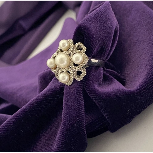 20 - AN ORNATE 9CT WHITE GOLD PEARL & DIAMOND STATEMENT RING, featuring five pearls on white gold setting... 