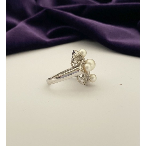 20 - AN ORNATE 9CT WHITE GOLD PEARL & DIAMOND STATEMENT RING, featuring five pearls on white gold setting... 