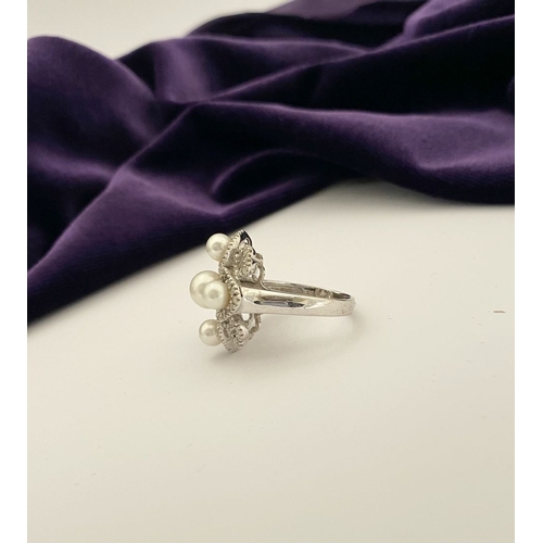 20 - AN ORNATE 9CT WHITE GOLD PEARL & DIAMOND STATEMENT RING, featuring five pearls on white gold setting... 