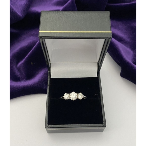 22 - A STUNNING PLATINUM THREE STONE DIAMOND RING, with three beautiful quality natural round brilliant c... 