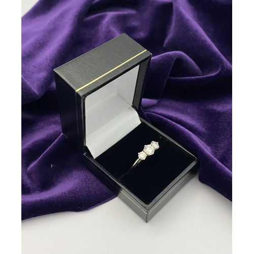 22 - A STUNNING PLATINUM THREE STONE DIAMOND RING, with three beautiful quality natural round brilliant c... 