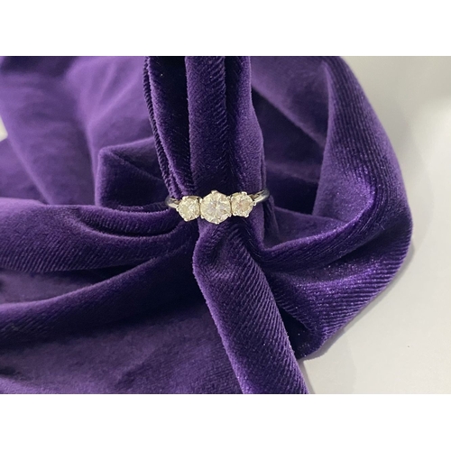 22 - A STUNNING PLATINUM THREE STONE DIAMOND RING, with three beautiful quality natural round brilliant c... 