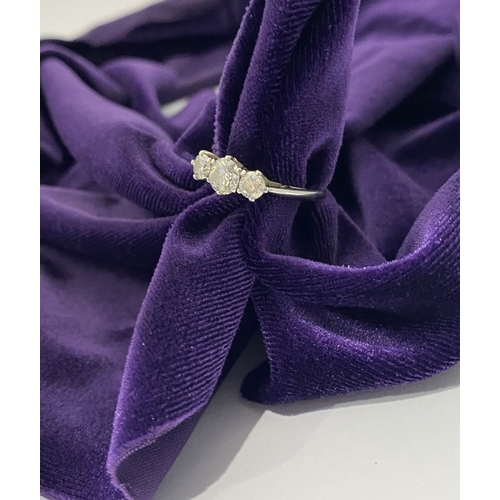 22 - A STUNNING PLATINUM THREE STONE DIAMOND RING, with three beautiful quality natural round brilliant c... 