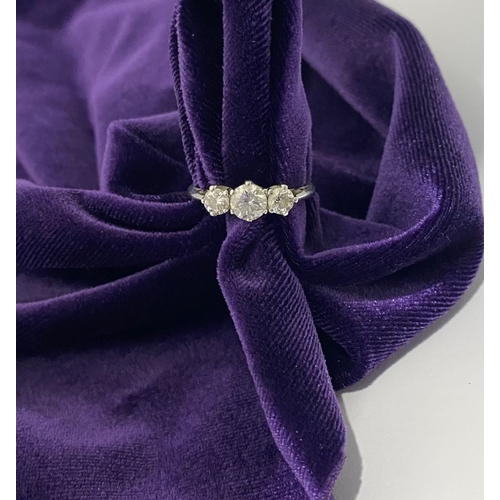 22 - A STUNNING PLATINUM THREE STONE DIAMOND RING, with three beautiful quality natural round brilliant c... 