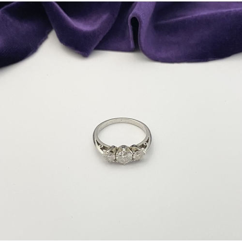 22 - A STUNNING PLATINUM THREE STONE DIAMOND RING, with three beautiful quality natural round brilliant c... 