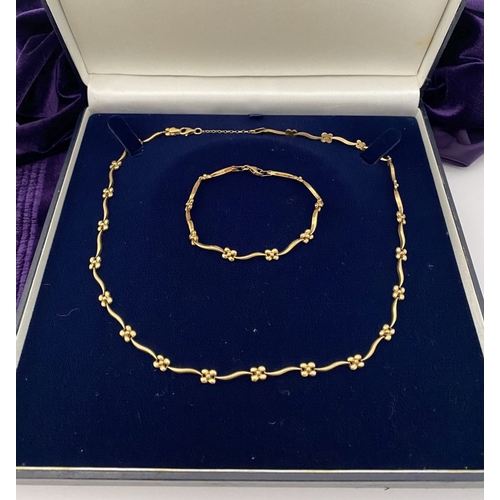 25 - A BEAUTIFUL 9CT GOLD NECKLACE & BRACELET, both with matching foliate design and long waving links, h... 