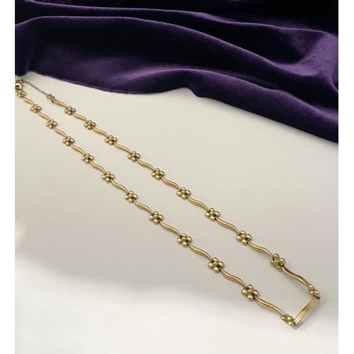 25 - A BEAUTIFUL 9CT GOLD NECKLACE & BRACELET, both with matching foliate design and long waving links, h... 