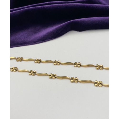 25 - A BEAUTIFUL 9CT GOLD NECKLACE & BRACELET, both with matching foliate design and long waving links, h... 