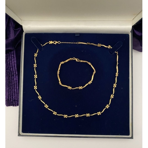 25 - A BEAUTIFUL 9CT GOLD NECKLACE & BRACELET, both with matching foliate design and long waving links, h... 