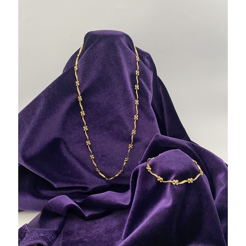 25 - A BEAUTIFUL 9CT GOLD NECKLACE & BRACELET, both with matching foliate design and long waving links, h... 