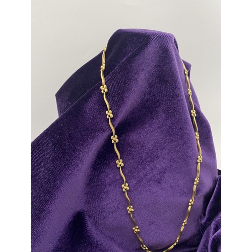 25 - A BEAUTIFUL 9CT GOLD NECKLACE & BRACELET, both with matching foliate design and long waving links, h... 
