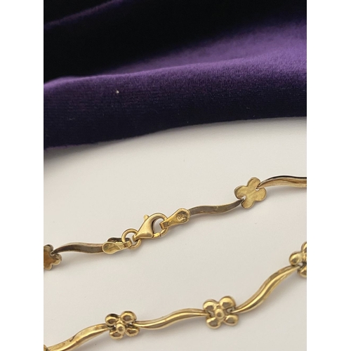 25 - A BEAUTIFUL 9CT GOLD NECKLACE & BRACELET, both with matching foliate design and long waving links, h... 