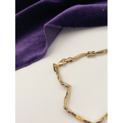 25 - A BEAUTIFUL 9CT GOLD NECKLACE & BRACELET, both with matching foliate design and long waving links, h... 