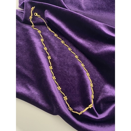 25 - A BEAUTIFUL 9CT GOLD NECKLACE & BRACELET, both with matching foliate design and long waving links, h... 