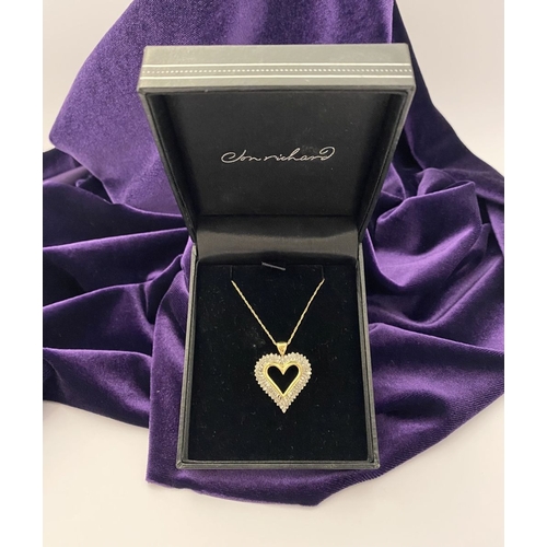 31 - A STUNNING 10CT YELLOW GOLD WHITE SAPPHIRE HEART PENDANT NECKLACE, the heart shaped pendant set with... 