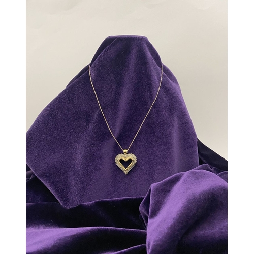 31 - A STUNNING 10CT YELLOW GOLD WHITE SAPPHIRE HEART PENDANT NECKLACE, the heart shaped pendant set with... 